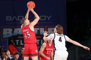 Nov 29, 2024; Paradise Island, Bahamas, BHS;  Davidson Wildcats guard Roberts Blums (45) shoots over Gonzaga Bulldogs guard Dusty Stromer (4) during the first half at Imperial Arena at the Atlantis resort.  Mandatory Credit: Kevin Jairaj-Imagn Images