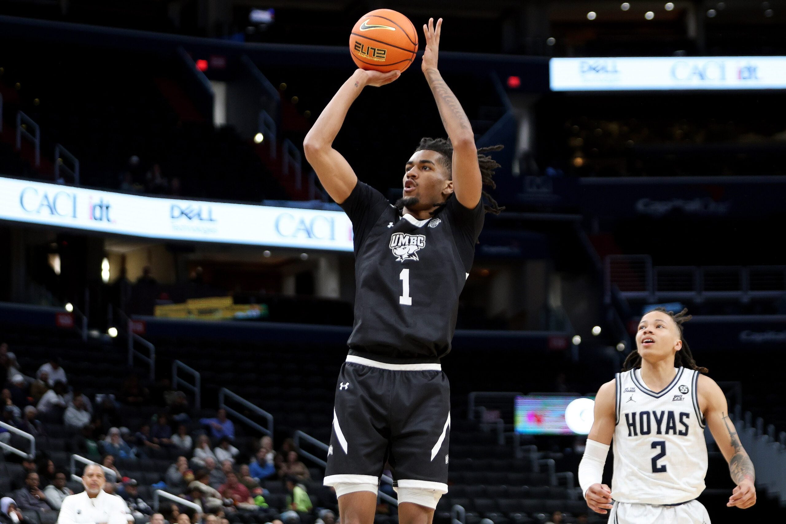 Dec 2, 2024; Washington, District of Columbia, USA; UMBC Retrievers guard Ace Valentine (1) shoots the ball as Georgetown Hoyas guard Malik Mack (2) looks on during the first half at Capital One Arena. Mandatory Credit: Daniel Kucin Jr.-Imagn Images