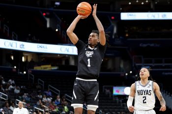 Dec 2, 2024; Washington, District of Columbia, USA; UMBC Retrievers guard Ace Valentine (1) shoots the ball as Georgetown Hoyas guard Malik Mack (2) looks on during the first half at Capital One Arena. Mandatory Credit: Daniel Kucin Jr.-Imagn Images