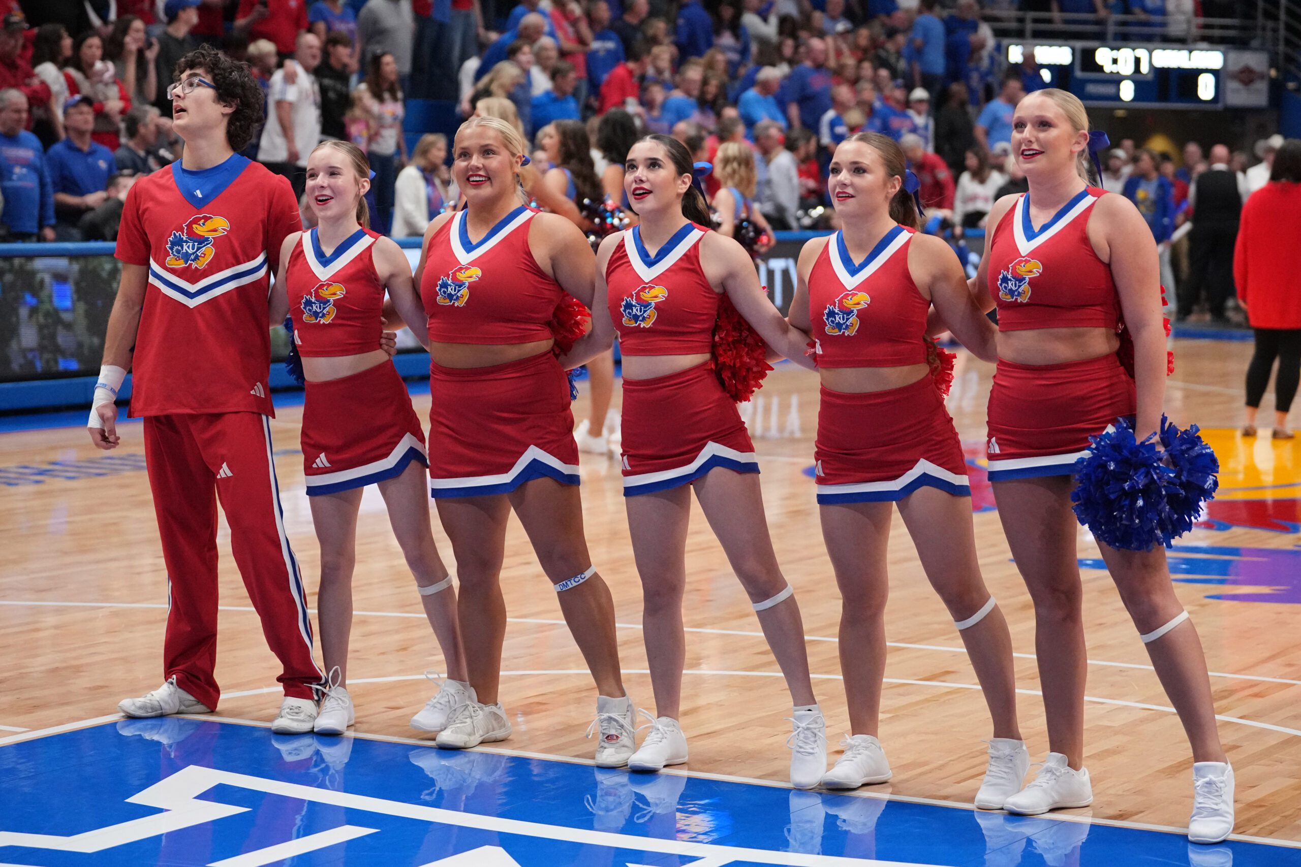 Nov 16, 2024; Lawrence, Kansas, USA; Kansas Jayhawks cheerleaders performs prior to a game against the Oakland Golden Grizzlies at Allen Fieldhouse. Mandatory Credit: Denny Medley-Imagn Images