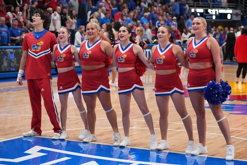 Nov 16, 2024; Lawrence, Kansas, USA; Kansas Jayhawks cheerleaders performs prior to a game against the Oakland Golden Grizzlies at Allen Fieldhouse. Mandatory Credit: Denny Medley-Imagn Images