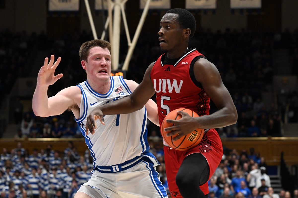 Dec 10, 2024; Durham, North Carolina, USA; dIncarnate Word Cardinals guard Davion Bailey (5) drives to the basket as Duke Blue Devils forward Kon Knueppel (7) defends during the first half at Cameron Indoor Stadium. Mandatory Credit: Rob Kinnan-Imagn Images