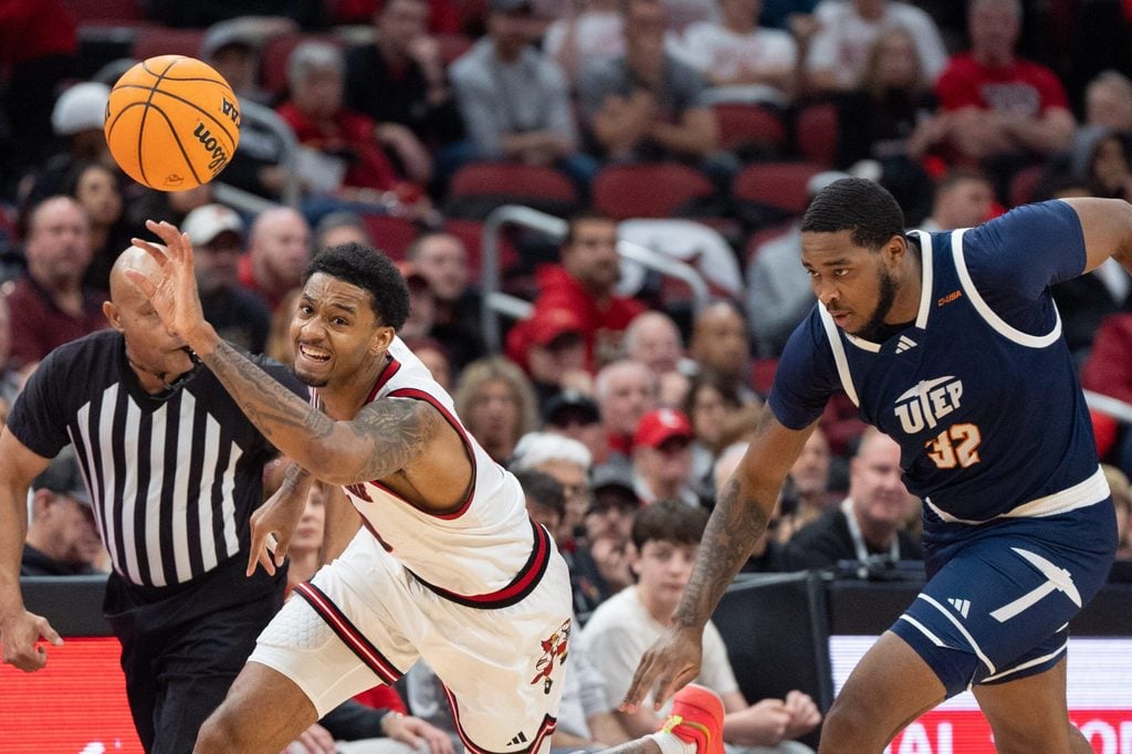 Louisville Cardinals forward James Scott (0) races for the loose ball against UTEP Miners forward Derick Hamilton (32) during their game on Wednesday, Dec. 11, 2024 at the KFC Yum! Center in Louisville, Ky.
