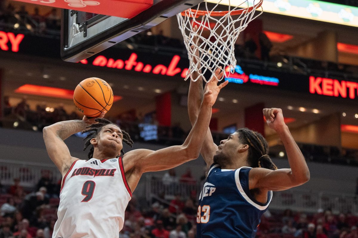 Louisville Cardinals forward Khani Rooths (9) goes for a shot against UTEP Miners forward Elijah Jones (33) during their game on Wednesday, Dec. 11, 2024 at the KFC Yum! Center in Louisville, Ky.