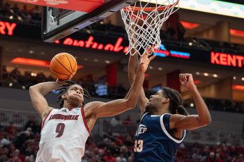 Louisville Cardinals forward Khani Rooths (9) goes for a shot against UTEP Miners forward Elijah Jones (33) during their game on Wednesday, Dec. 11, 2024 at the KFC Yum! Center in Louisville, Ky.