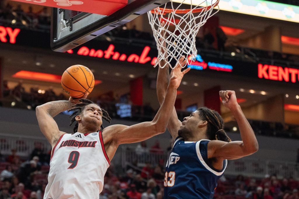 Louisville Cardinals forward Khani Rooths (9) goes for a shot against UTEP Miners forward Elijah Jones (33) during their game on Wednesday, Dec. 11, 2024 at the KFC Yum! Center in Louisville, Ky.