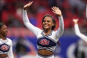 Dec 14, 2024; Atlanta, GA, USA; South Carolina State Bulldogs cheerleader performs against the Jackson State Tigers in the fourth quarter at Mercedes-Benz Stadium. Mandatory Credit: Brett Davis-Imagn Images