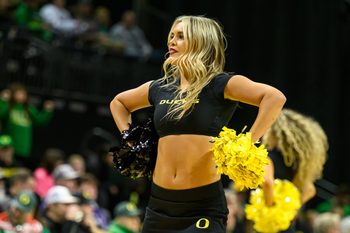 Dec 15, 2024; Eugene, Oregon, USA; Oregon Ducks cheerleader performs during the second half against the Stephen F. Austin Lumberjacks at Matthew Knight Arena. Mandatory Credit: Craig Strobeck-Imagn Images