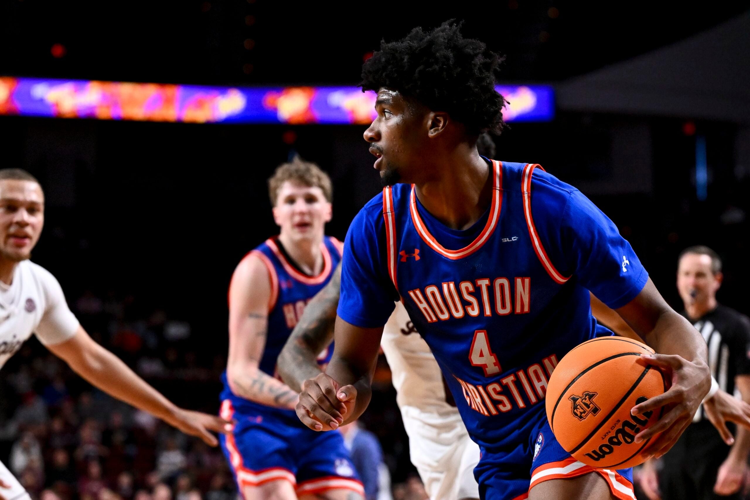 Dec 20, 2024; College Station, Texas, USA; Houston Christian Huskies guard Elijah Brooks (4) dribbles the ball during the second half against the Texas A&M Aggies at Reed Arena. The Aggies defeated the Huskies 77-45. Mandatory Credit: Maria Lysaker-Imagn Images