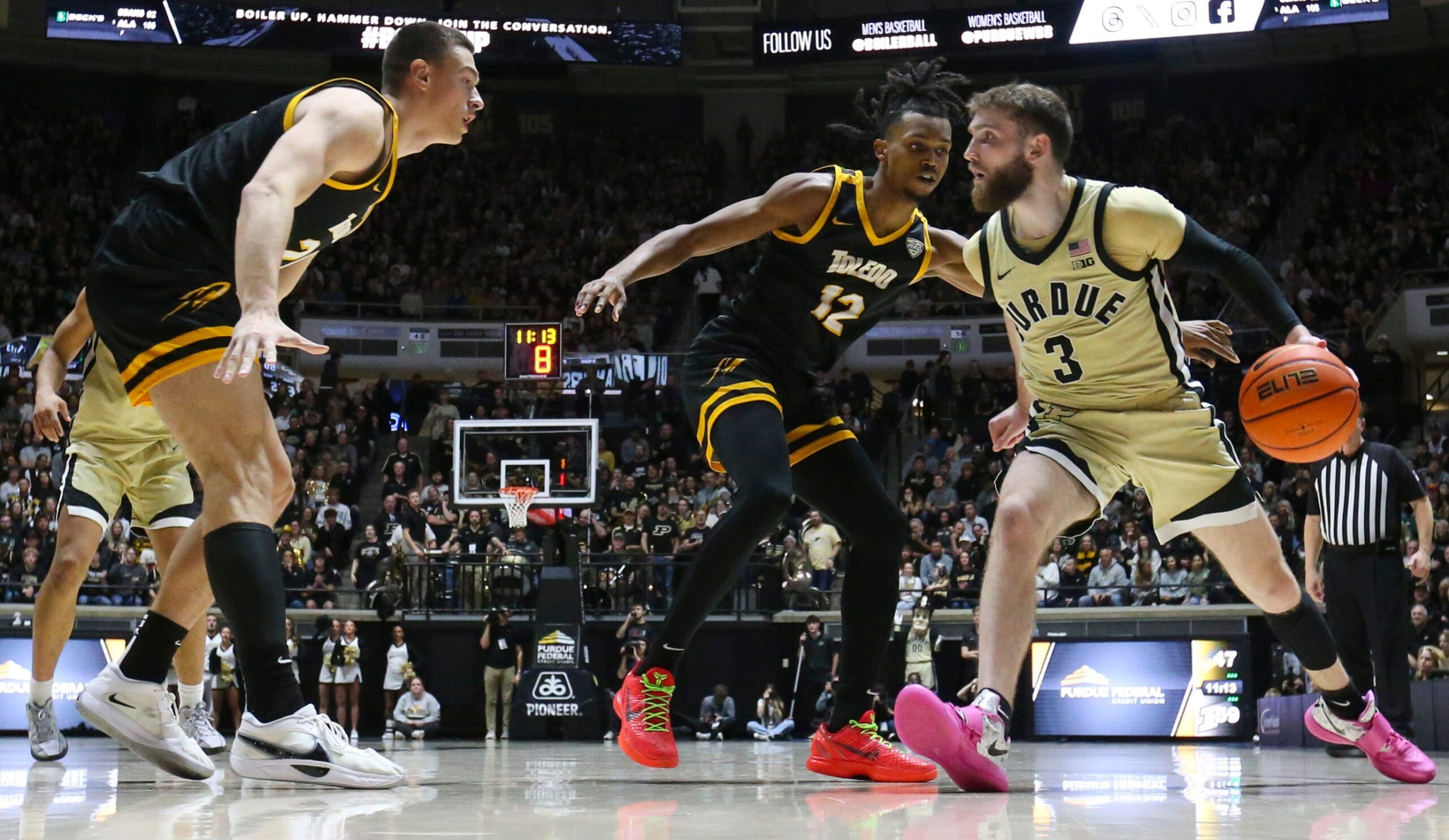 Toledo Rockets guard Seth Hubbard (12) defends Purdue Boilermakers guard Braden Smith (3) Sunday, Dec. 29, 2024, during the NCAA men’s basketball game at Mackey Arena in West Lafayette, Ind. Purdue Boilermakers won 83-64.