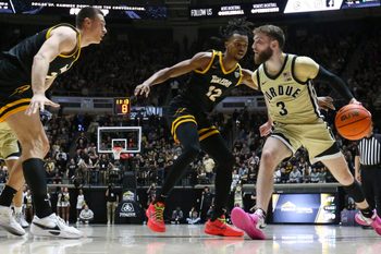 Toledo Rockets guard Seth Hubbard (12) defends Purdue Boilermakers guard Braden Smith (3) Sunday, Dec. 29, 2024, during the NCAA men’s basketball game at Mackey Arena in West Lafayette, Ind. Purdue Boilermakers won 83-64.