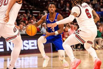 Dec 30, 2024; Columbia, South Carolina, USA; Presbyterian Blue Hose guard Kory Mincy (4) drives against the South Carolina Gamecocks in the second half at Colonial Life Arena. Mandatory Credit: Jeff Blake-Imagn Images