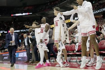 Wisconsin guard Daniel Freitag, right, and the rest of the Wisconsin bench are shown during the second half of their game Friday, January 10, 2025 at the Kohl Center in Madison, Wisconsin. Wisconsin beat Minnesota 80-59.