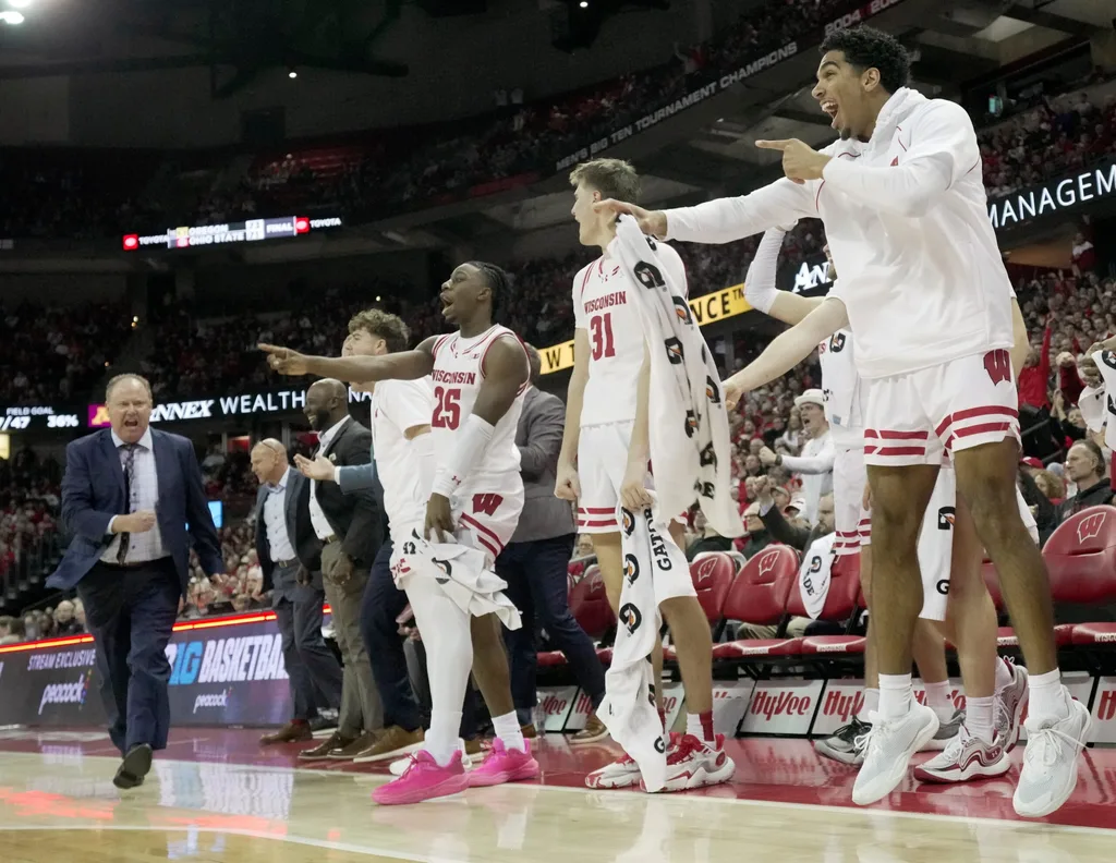 Wisconsin guard Daniel Freitag, right, and the rest of the Wisconsin bench are shown during the second half of their game Friday, January 10, 2025 at the Kohl Center in Madison, Wisconsin. Wisconsin beat Minnesota 80-59.