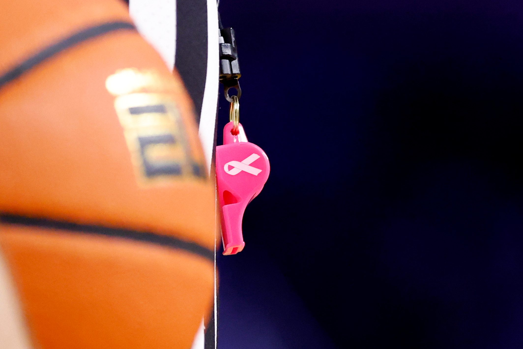 Jan 27, 2025; Ann Arbor, Michigan, USA;  Referees use pink whistles during the game between the Michigan Wolverines and the Penn State Nittany Lions at Crisler Center. Mandatory Credit: Rick Osentoski-Imagn Images