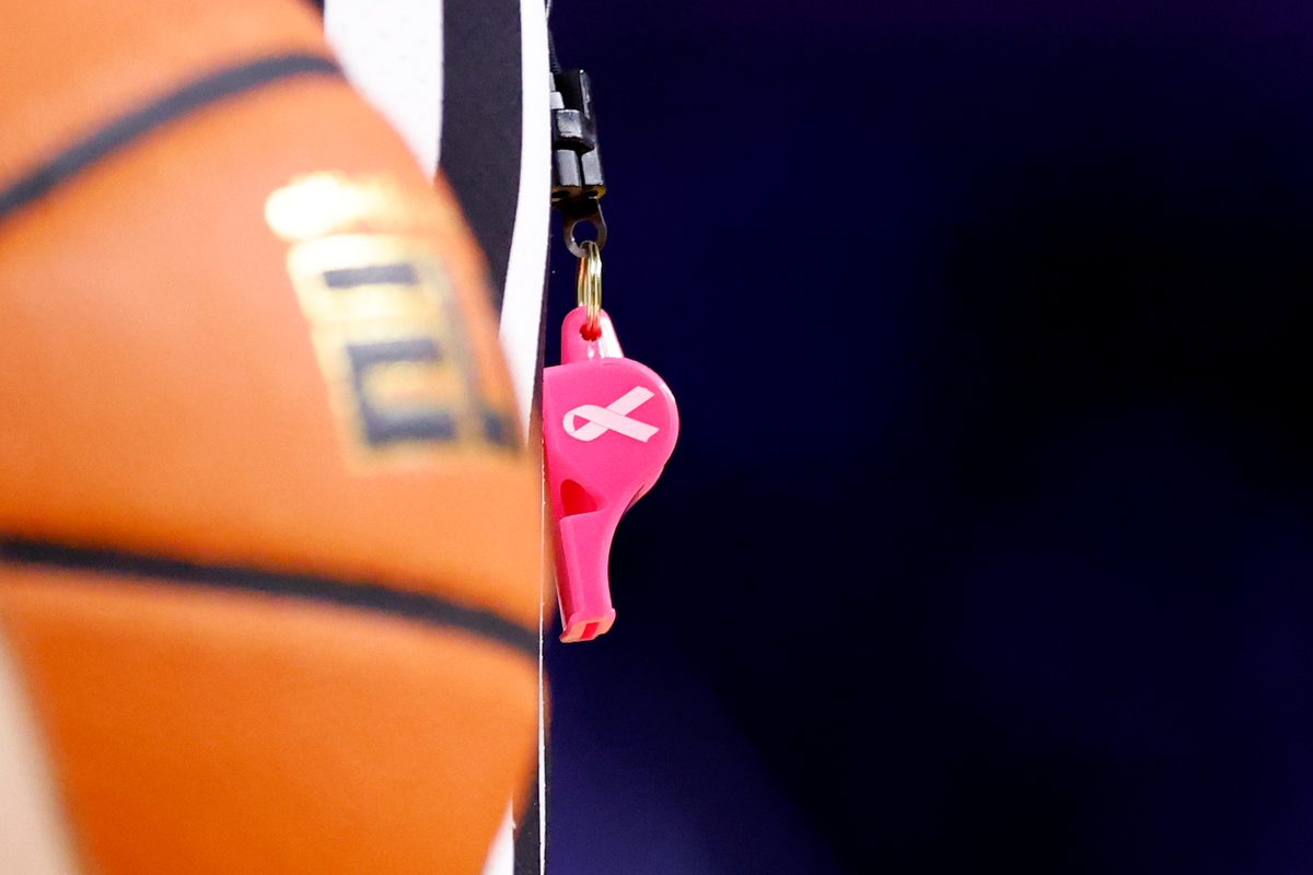 Jan 27, 2025; Ann Arbor, Michigan, USA; Referees use pink whistles during the game between the Michigan Wolverines and the Penn State Nittany Lions at Crisler Center. Mandatory Credit: Rick Osentoski-Imagn Images