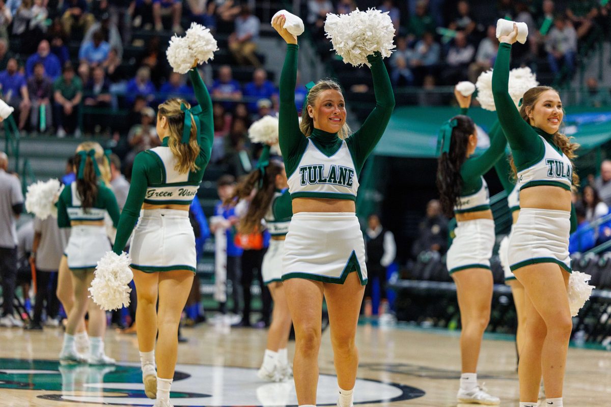 Jan 30, 2025; New Orleans, Louisiana, USA; Tulane Green Wave cheerleaders perform on a time out against the Memphis Tigers during the second half at Avron B. Fogelman Arena in Devlin Fieldhouse. Mandatory Credit: Stephen Lew-Imagn Images