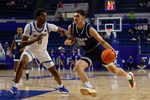 Feb 4, 2025; Colorado Springs, Colorado, USA; Nevada Wolf Pack guard Daniel Foster (20) controls the ball as Air Force Falcons guard Byron Brown (11) guards in the second half at Clune Arena. Mandatory Credit: Isaiah J. Downing-Imagn Images