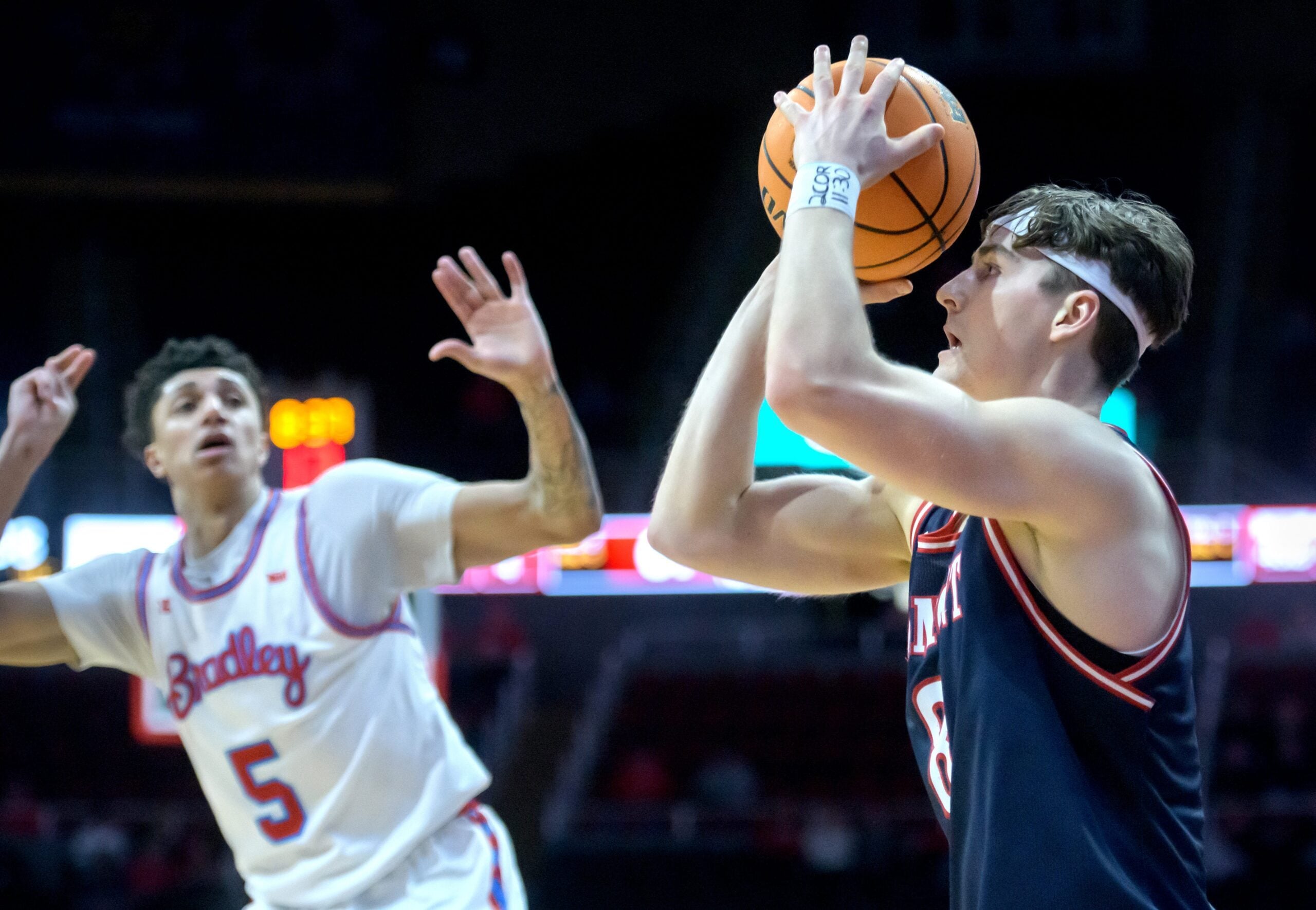 Belmont’s Tyler Lundblade, right, lines up one of his three-pointers against Bradley in the second half of their MVC basketball game Wednesday, Feb. 5, 2025 at Carver Arena. Lundblade dropped eight three-pointers and the Braves fell to the Bruins 80-77.