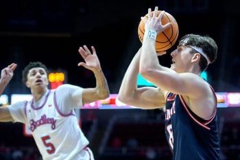 Belmont’s Tyler Lundblade, right, lines up one of his three-pointers against Bradley in the second half of their MVC basketball game Wednesday, Feb. 5, 2025 at Carver Arena. Lundblade dropped eight three-pointers and the Braves fell to the Bruins 80-77.