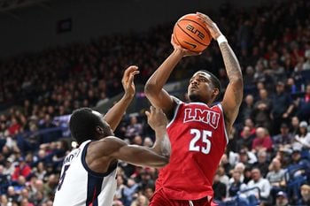 Feb 6, 2025; Spokane, Washington, USA; Loyola Marymount Lions forward Caleb Stone-Carrawell (25) shoots over Gonzaga Bulldogs forward Emmanuel Innocenti (5) in the second half at McCarthey Athletic Center. Gonzaga Bulldogs won 73-53. Mandatory Credit: James Snook-Imagn Images