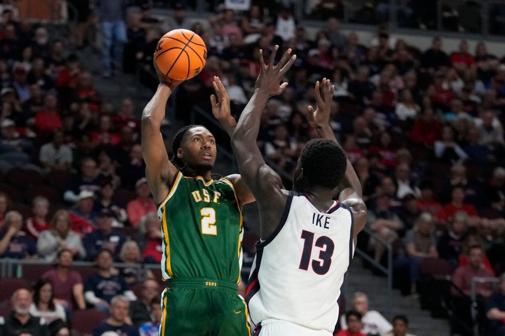 March 10, 2025; Las Vegas, NV, USA; San Francisco Dons center Carlton Linguard Jr. (2) shoots the basketball against Gonzaga Bulldogs forward Graham Ike (13) during the second half in the semifinal of the West Coast Conference tournament at Orleans Arena. Mandatory Credit: Kyle Terada-Imagn Images