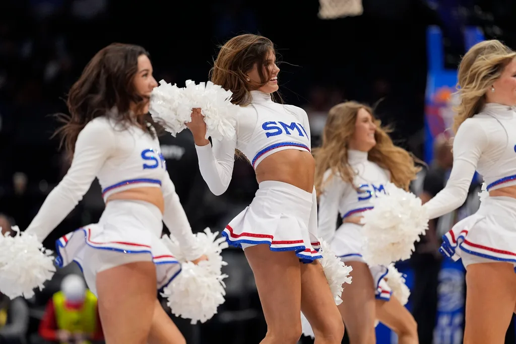 Mar 12, 2025; Charlotte, NC, USA; Southern Methodist Mustangs cheerleaders perform during the first half against the Syracuse Orange at Spectrum Center. Mandatory Credit: Jim Dedmon-Imagn Images