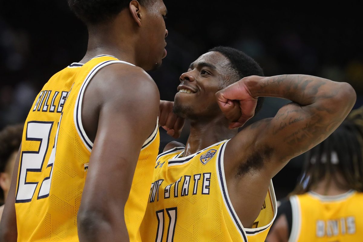 Kent State Golden Flashes guard Cian Medley (11) celebrates with forward Delrecco Gillespie (23) during the second half of an NCAA college basketball game in the semifinals of the Mid-American Conference Tournament at Rocket Arena on Friday, March 14, 2025, in Cleveland, Ohio.