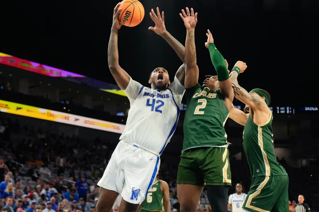 Mar 16, 2025; Fort Worth, TX, USA; Memphis Tigers forward Dain Dainja (42) scores a basket against UAB Blazers guard Ja'Borri McGhee (2) during the second half at Dickies Arena. Mandatory Credit: Chris Jones-Imagn Images