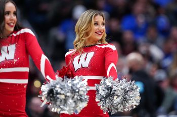 Mar 20, 2025; Denver, CO, USA; A cheerleader for the Wisconsin Badgers performs during the second half between the Wisconsin Badgers and the Montana Grizzlies in the first round of the NCAA Tournament at Ball Arena. Mandatory Credit: Ron Chenoy-Imagn Images