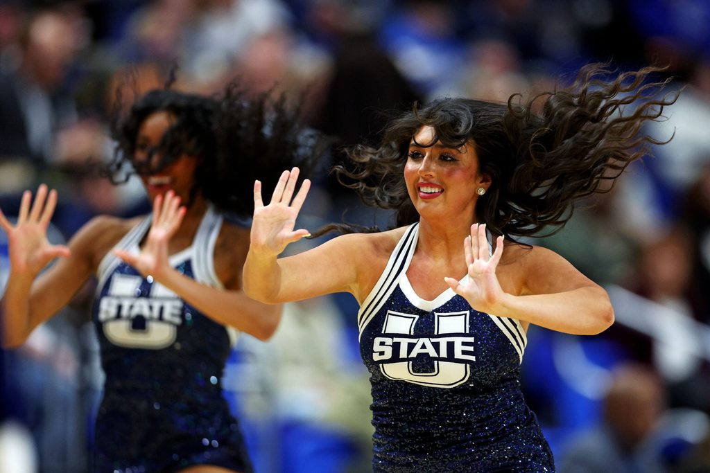 Mar 20, 2025; Lexington, KY, USA; The Utah State Aggies cheerleaders during the second half of the game between the UCLA Bruins and the Utah State Aggies in the first round of the NCAA Tournament at Rupp Arena. Mandatory Credit: Jordan Prather-Imagn Images