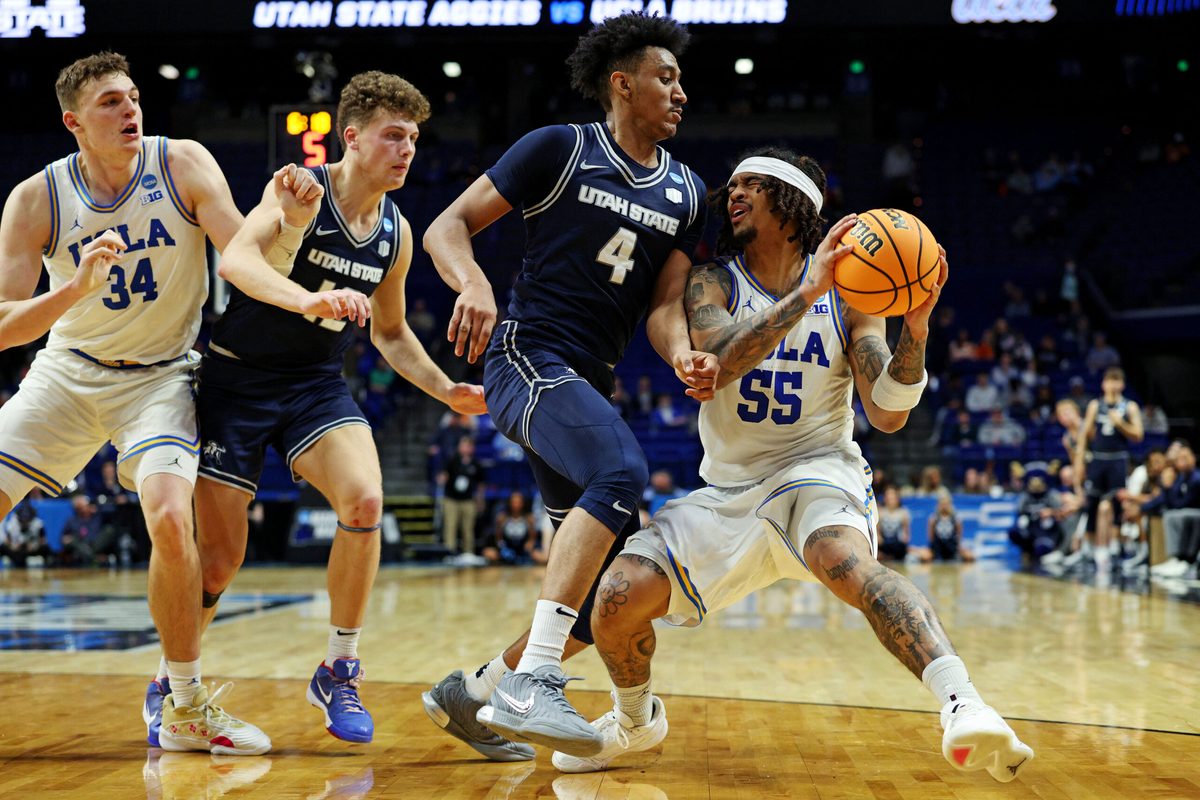 Mar 20, 2025; Lexington, KY, USA; UCLA Bruins guard Skyy Clark (55) drives to the basket against Utah State Aggies guard Ian Martinez (4) during the second half in the first round of the NCAA Tournament at Rupp Arena. Mandatory Credit: Jordan Prather-Imagn Images