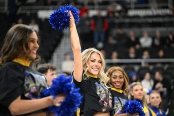 Mar 22, 2025; Providence, RI, USA; McNeese State Cowboys cheerleaders wear shirts with McNeese State Cowboys manager Amir Khan (not pictured) before a second round men’s NCAA Tournament game against the Purdue Boilermakers at Amica Mutual Pavilion. Mandatory Credit: Brian Fluharty-Imagn Images
