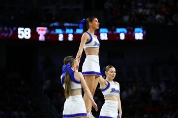 Mar 22, 2025; Wichita, KS, USA; Drake Bulldogs cheerleaders perform during the second half at Intrust Bank Arena. Mandatory Credit: Nick Tre. Smith-Imagn Images