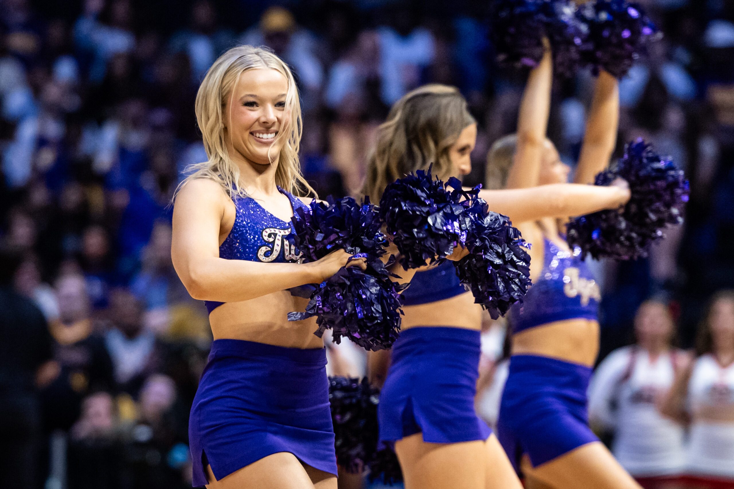 Mar 22, 2025; Baton Rouge, Louisiana, USA;  LSU Lady Tigers cheerleaders on a time out against the San Diego State Aztecs during the first half at Pete Maravich Assembly Center. Mandatory Credit: Stephen Lew-Imagn Images