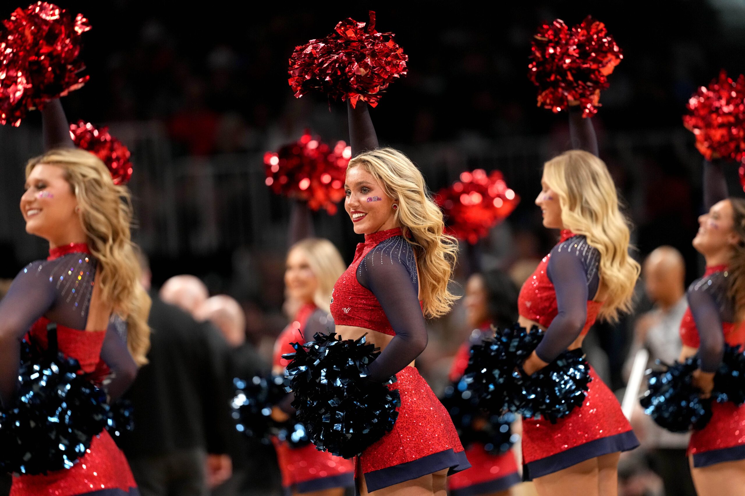 Mar 28, 2025; Atlanta, GA, USA; Mississippi Rebels cheerleaders in the second half of a South Regional semifinal of the 2025 NCAA tournament against the Michigan State Spartans at State Farm Arena. Mandatory Credit: Dale Zanine-Imagn Images