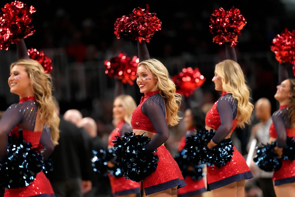 Mar 28, 2025; Atlanta, GA, USA; Mississippi Rebels cheerleaders in the second half of a South Regional semifinal of the 2025 NCAA tournament against the Michigan State Spartans at State Farm Arena. Mandatory Credit: Dale Zanine-Imagn Images