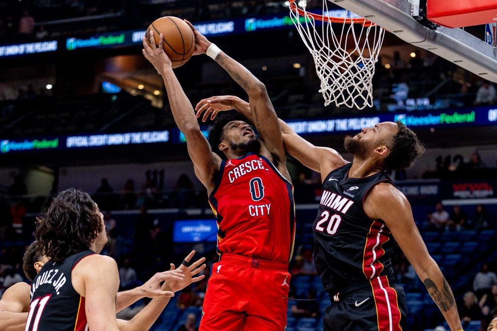 Apr 11, 2025; New Orleans, Louisiana, USA; Miami Heat forward Kyle Anderson (20) fouls New Orleans Pelicans forward Keion Brooks Jr. (0) during the second half at Smoothie King Center. Mandatory Credit: Stephen Lew-Imagn Images