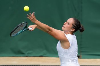 Jul 1, 2025; Wimbledon, UNITED KINGDOM; Elisabetta Cocciaretto of Italy tosses the ball to serve during her match against Jessica Pegula of the United States on day two at the All England Lawn Tennis and Croquet Club. Mandatory Credit: Susan Mullane-Imagn Images