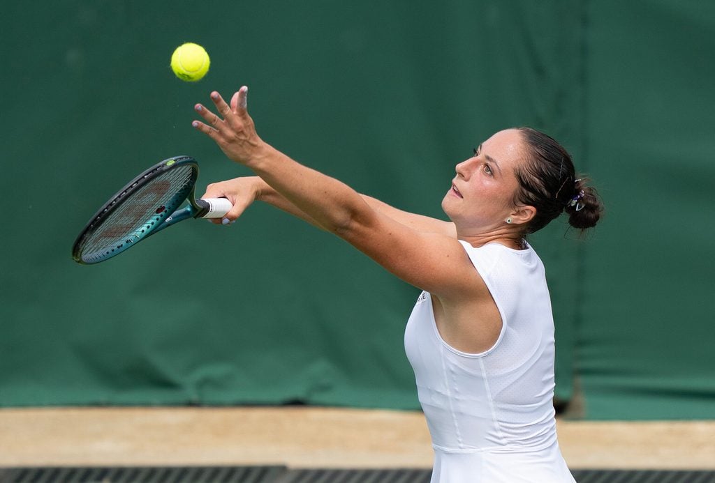 Jul 1, 2025; Wimbledon, UNITED KINGDOM; Elisabetta Cocciaretto of Italy tosses the ball to serve during her match against Jessica Pegula of the United States on day two at the All England Lawn Tennis and Croquet Club. Mandatory Credit: Susan Mullane-Imagn Images