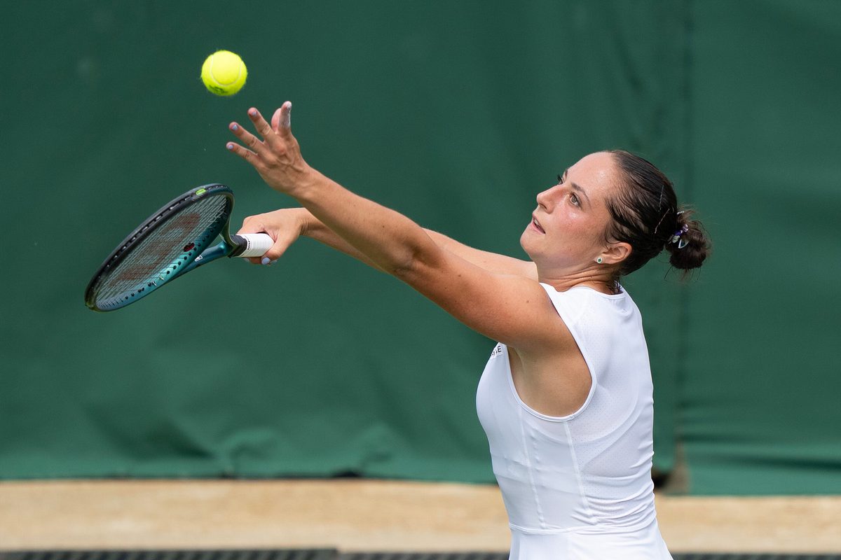 Jul 1, 2025; Wimbledon, UNITED KINGDOM; Elisabetta Cocciaretto of Italy tosses the ball to serve during her match against Jessica Pegula of the United States on day two at the All England Lawn Tennis and Croquet Club. Mandatory Credit: Susan Mullane-Imagn Images