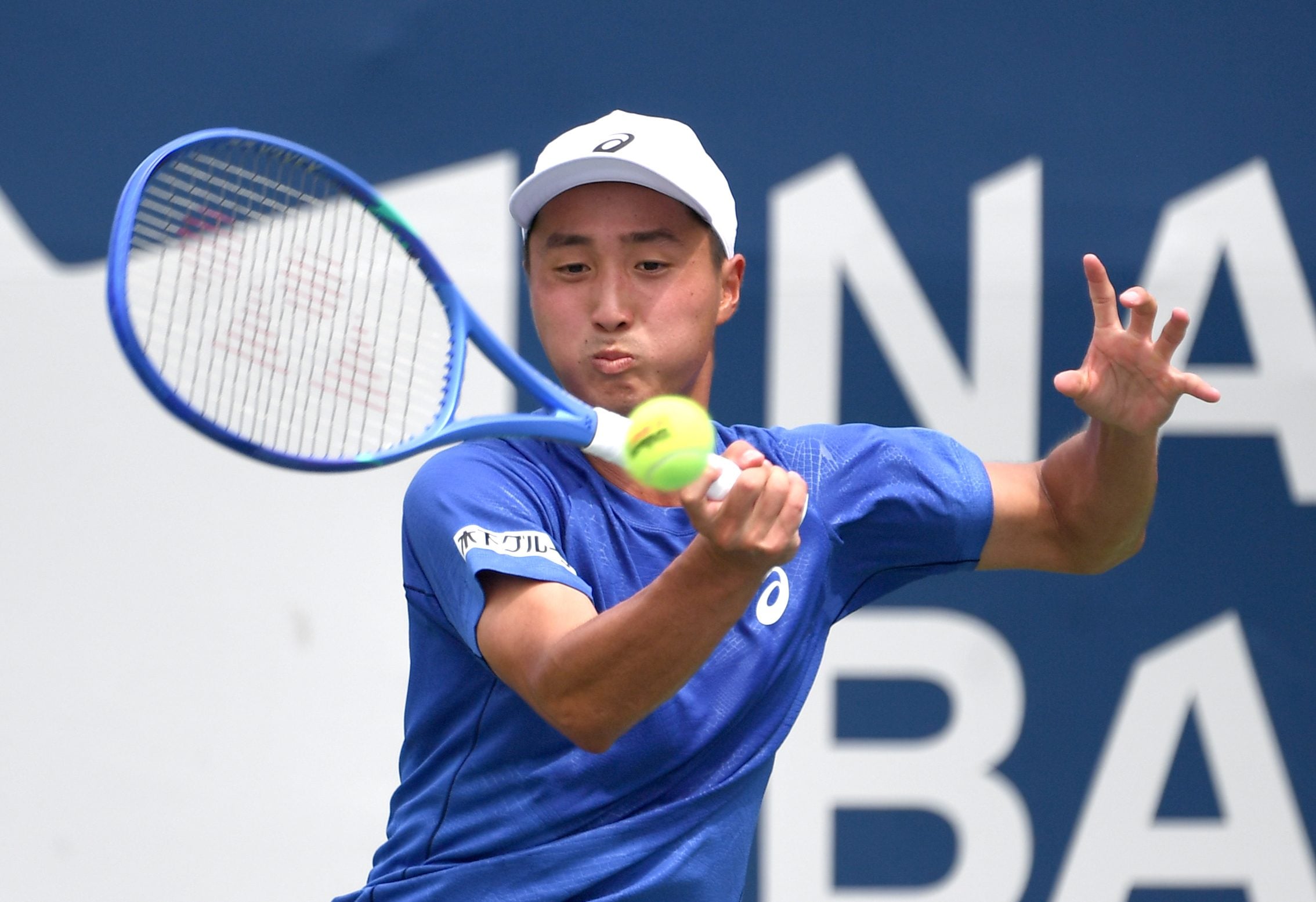 Jul 26, 2025; Toronto, ON, Canada;  Shintaro Mochizuki (JPN) plays a shot against Yasutaka Uchiyama (JPN) during qualifying play at Sobeys Stadium. Mandatory Credit: Dan Hamilton-Imagn Images