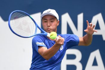 Jul 26, 2025; Toronto, ON, Canada;  Shintaro Mochizuki (JPN) plays a shot against Yasutaka Uchiyama (JPN) during qualifying play at Sobeys Stadium. Mandatory Credit: Dan Hamilton-Imagn Images