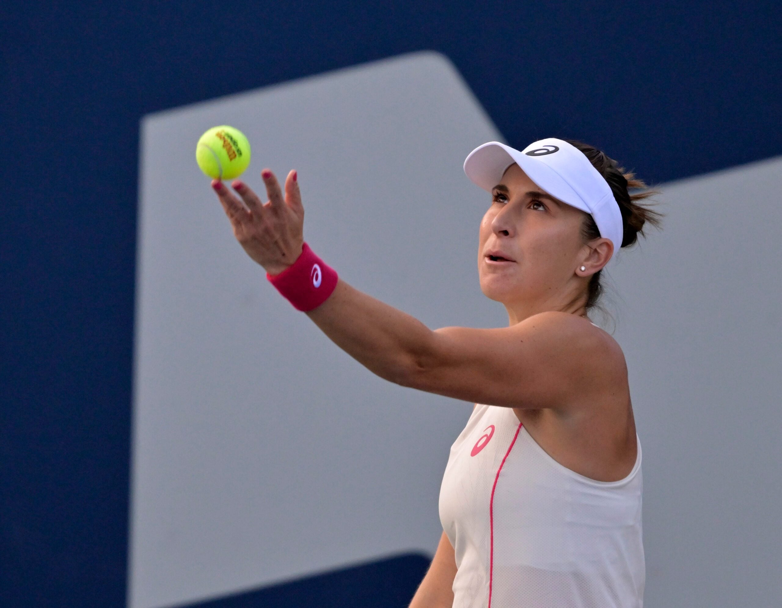 Aug 1, 2025; Montreal, QC, Canada; Belinda Bencic (SUI) serves against Karolina Muchova (CZE) in third round play at IGA Stadium. Mandatory Credit: Eric Bolte-Imagn Images