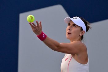 Aug 1, 2025; Montreal, QC, Canada; Belinda Bencic (SUI) serves against Karolina Muchova (CZE) in third round play at IGA Stadium. Mandatory Credit: Eric Bolte-Imagn Images