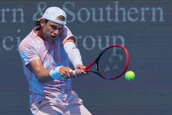 Aug 7, 2025; Cincinnati, OH, USA; Zizou Bergs (BEL) returns a shot against Jacob Fearnley (GBR) during the Cincinnati Open at the Lindner Family Tennis Center. Mandatory Credit: Aaron Doster-Imagn Images