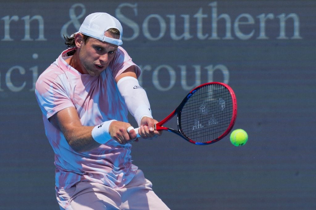 Aug 7, 2025; Cincinnati, OH, USA; Zizou Bergs (BEL) returns a shot against Jacob Fearnley (GBR) during the Cincinnati Open at the Lindner Family Tennis Center. Mandatory Credit: Aaron Doster-Imagn Images