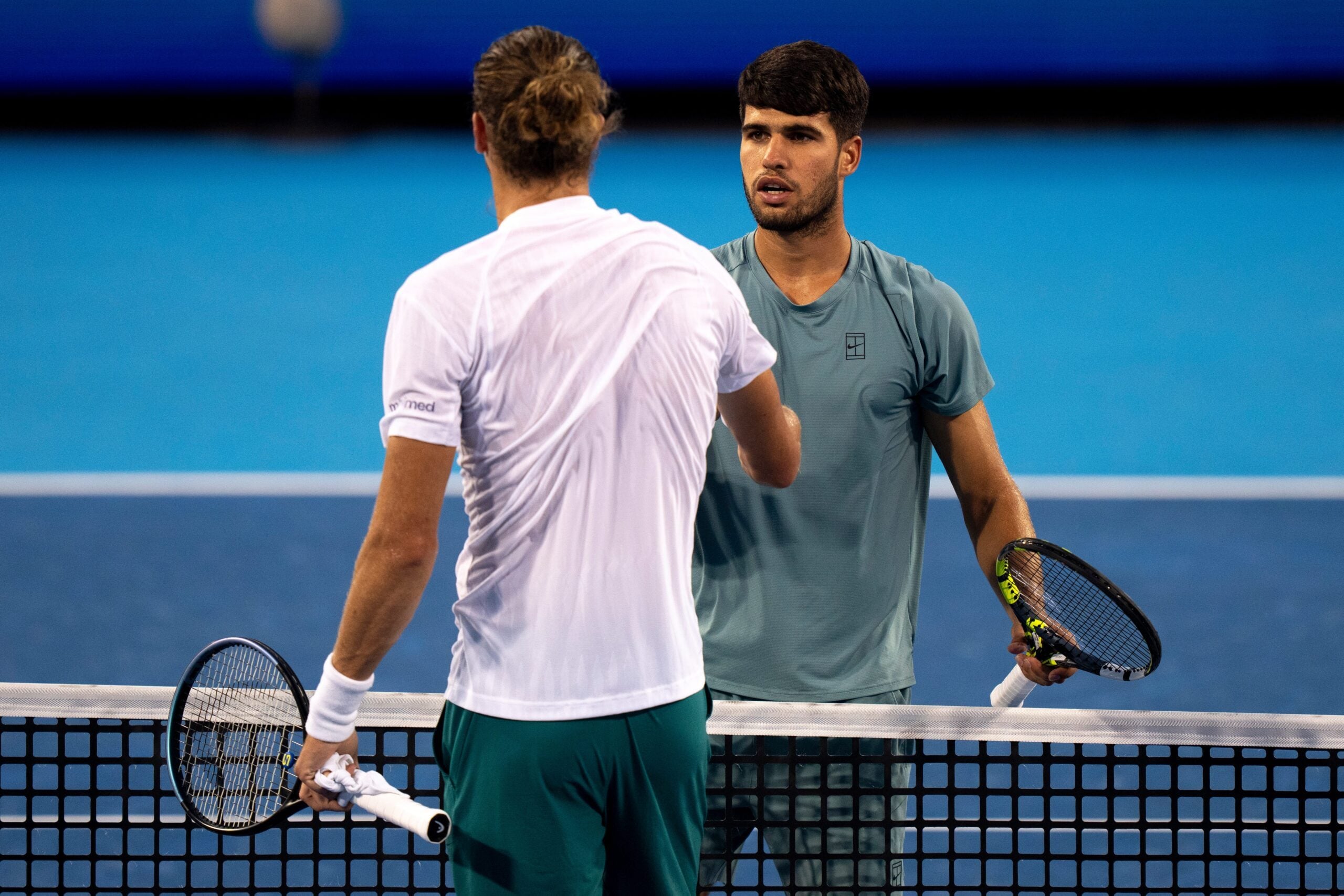 Carlos Alcaraz, of Spain, shakes the hand of Alexander Zverev, of Germany, after winning during the Cincinnati Open in Mason on Aug. 16, 2025.