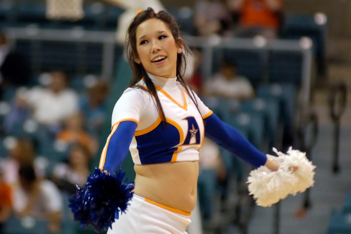 Mar 14, 2008; Katy, TX, USA; UT Arlington Mavericks cheerleader cheers on her team against the Sam Houston Bearkats in the second half of the Southland Conference Tournament at the Merrell Center. Mandatory Credit: Brett Davis-Imagn Images