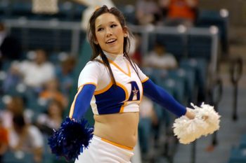 Mar 14, 2008; Katy, TX, USA; UT Arlington Mavericks cheerleader cheers on her team against the Sam Houston Bearkats in the second half of the Southland Conference Tournament at the Merrell Center. Mandatory Credit: Brett Davis-Imagn Images